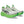 White running shoes with green soles on a white background