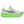 White running shoe with green sole on a white background