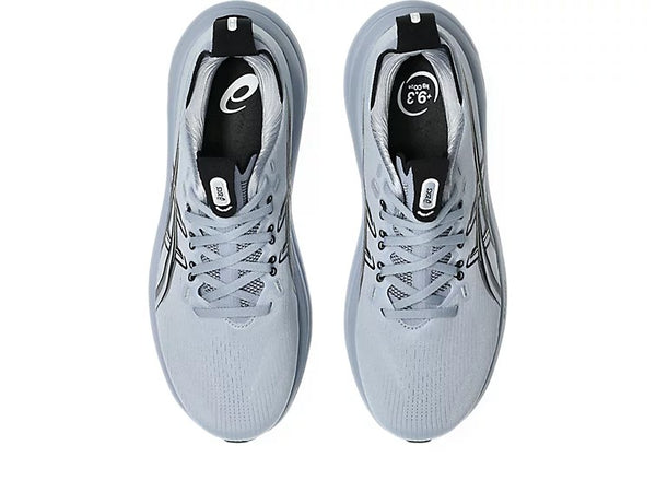 Pair of gray -blue running shoes with black accents on a white background