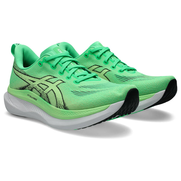 Green running shoes with black accents on a white background