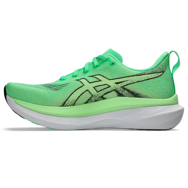 Green running shoe with white sole on a white background