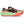 Multicolored running shoe with a green sole on a white background