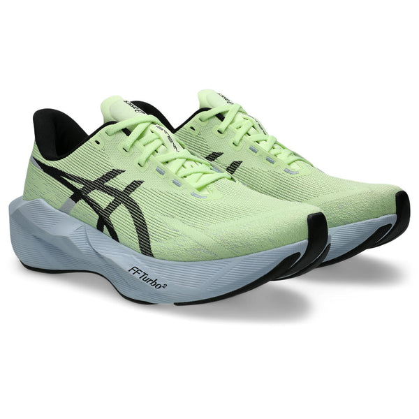 Light green running shoe with black accents on a white background