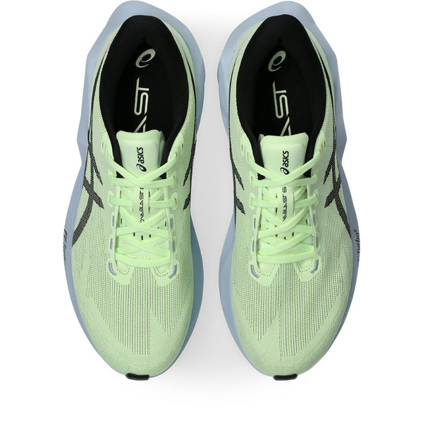 Light green running shoe with black accents on a white background