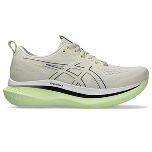 A pair of beige Asics Glideride Max sneakers with green accents on the outsole.
