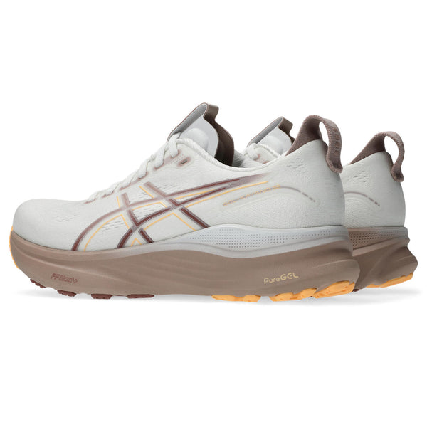 White and brown running shoe with visible brand logo on a white background