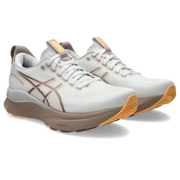 A pair of Kaynao 32 running shoes with whit shoe laces and a brown outsole.