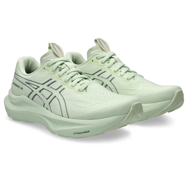 A pair of ASICS light green running shoes on a white background.