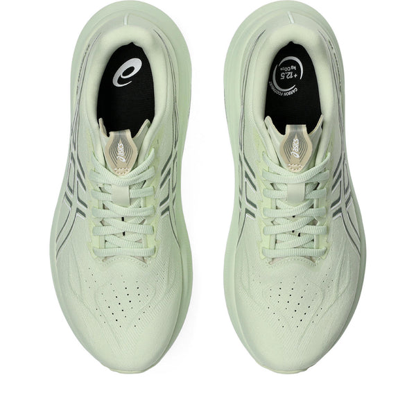 A pair of light green running shoes with black accents showng the great silouette of these shoes.