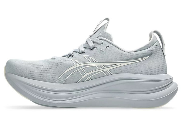 Gray running shoe with white sole on a white background