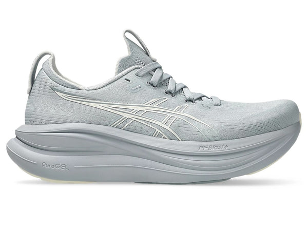 Gray running shoe with white sole on a white background