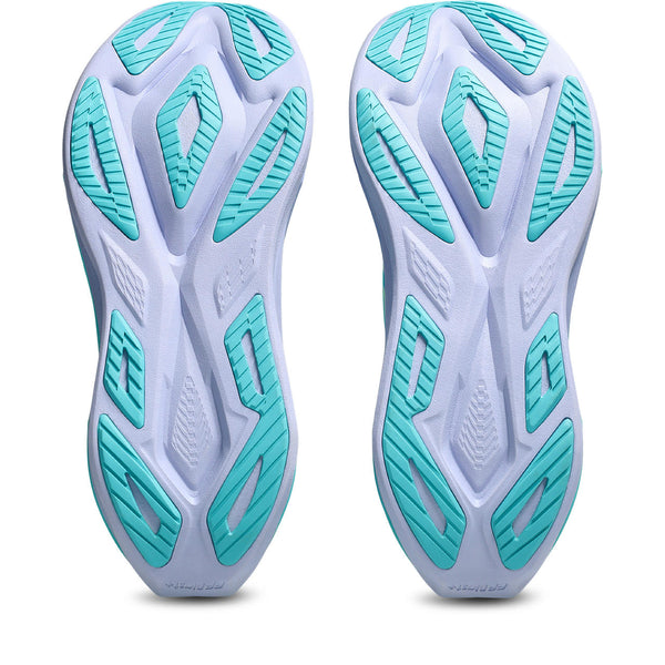 Pair of white and turquoise athletic shoes on a white background
