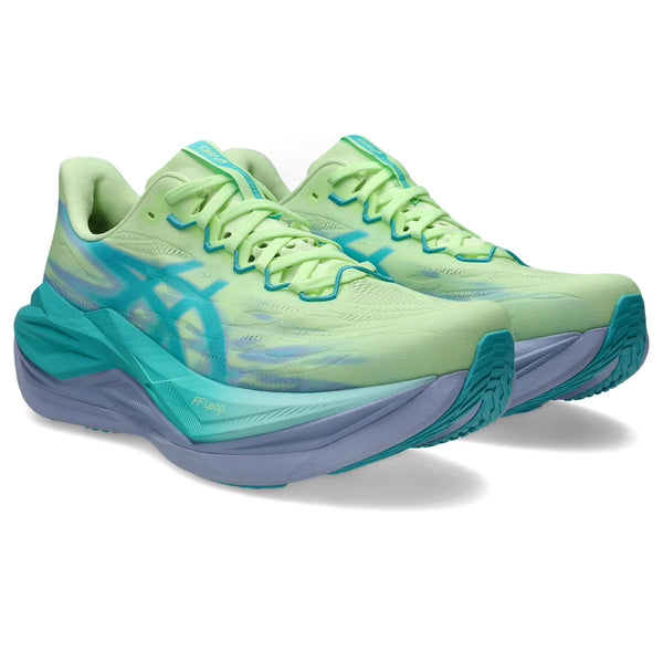 Pair of green and blue running shoes on a white background