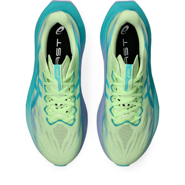 Pair of neon green running shoes with blue accents on a white background