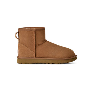 Tan lower calf length boot on a white background