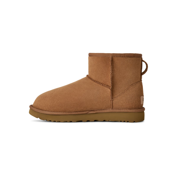 Tan lower calf length boot on a white background