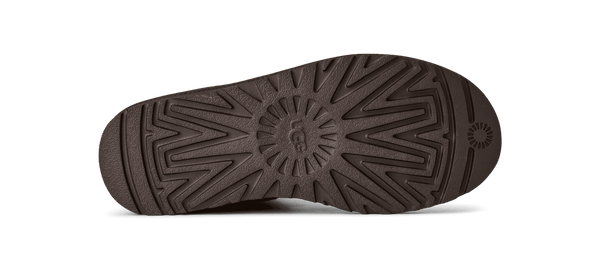 The outsole of this boot has UGG carved into the middle. 