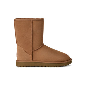 Calf height tan slipper boot on a white background