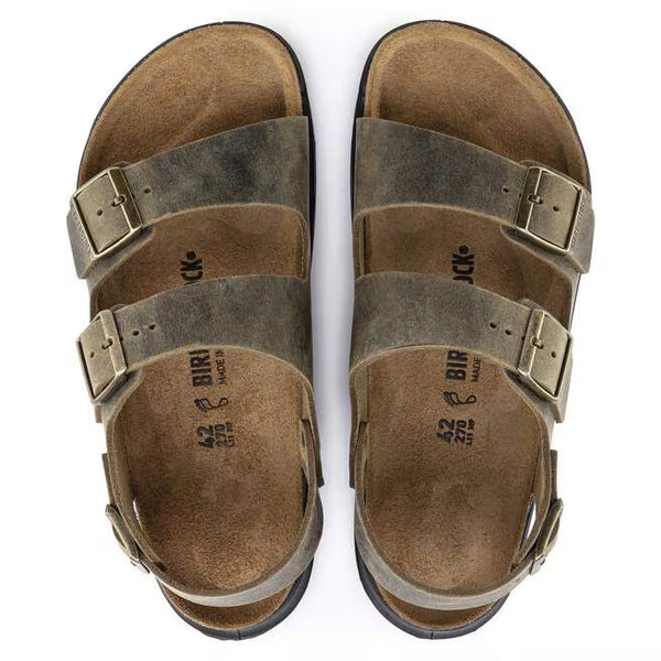 The upper of this shoe is two large straps with buckles on the lateral sides and a large strap around the heel with a buckle. 