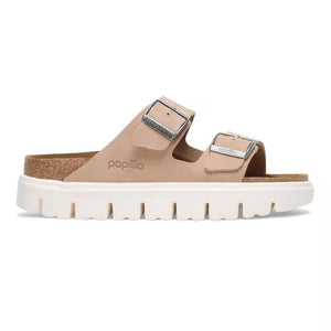This Arizona sandal has a suede upper, a cork midsole, and a EVA platform outsole. 