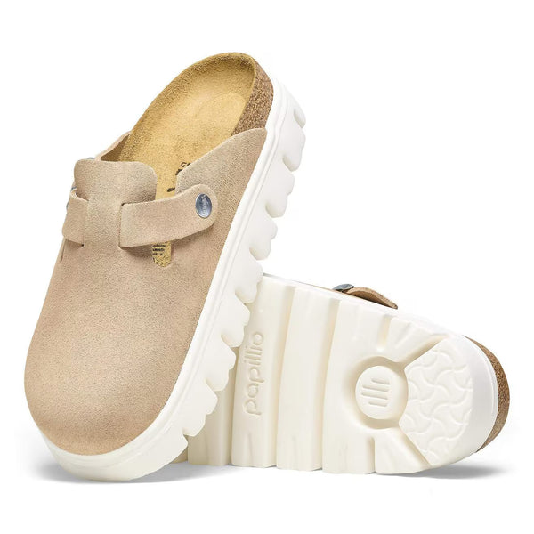 The EVA outsole on this shoe is white and has deep horizontal lines running through it. 
