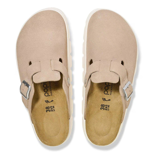 The upper of this shoe is beige almost pink and has silver buckles. 