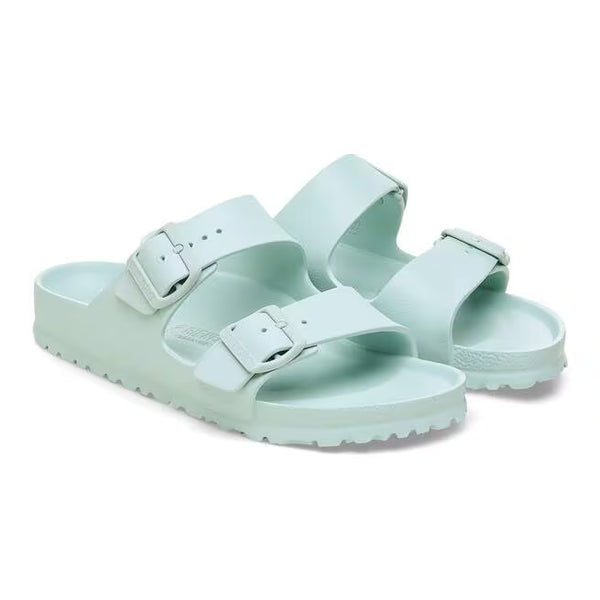 The upper of this shoe is two large straps with buckles on the lateral sides. 
