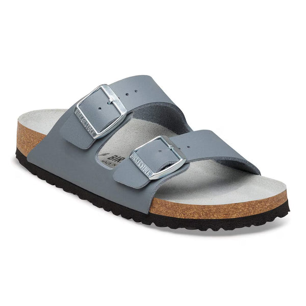 Slate grey sandal with a cork midsole on a white background