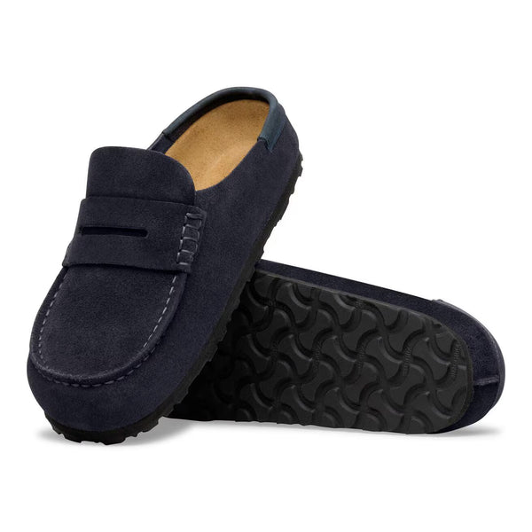 Navy suede loafer style clog on a white background