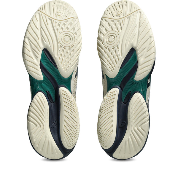 Close-up of a pair of sports shoes with a focus on the sole design.