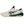 White and navy athletic shoe with green accents on a white background