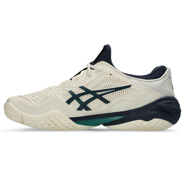 White and navy athletic shoe with green accents on a white background