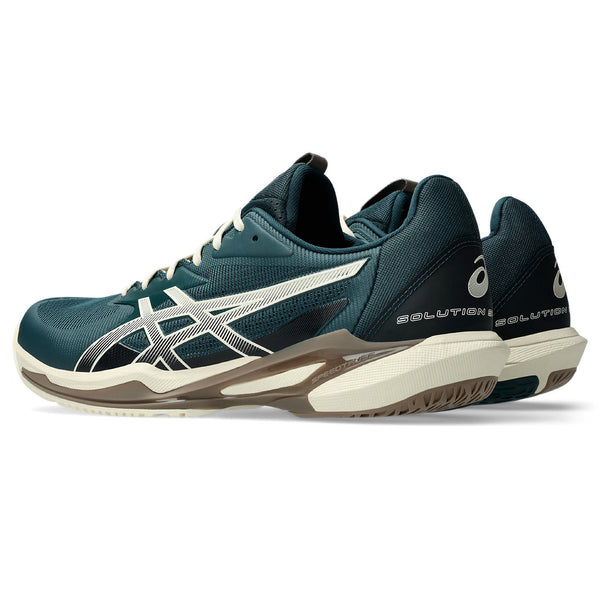 Green athletic shoe with white accents on a white background.