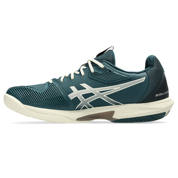 Blue athletic shoe with white laces and sole on a white background.