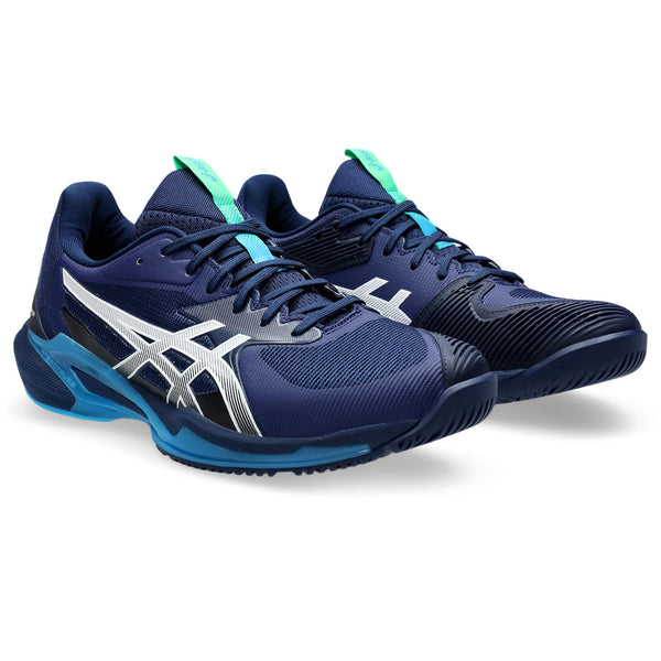 A pair of ASICS tennis shoes with a blue upper and matching blue laces.