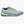 Gray athletic shoe with yellow accents on a white background