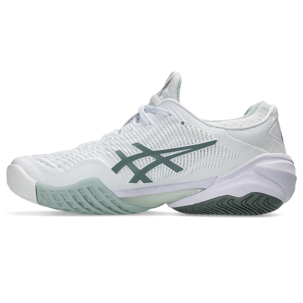 Medial side of a white and light green SICS tennis shoe with a dark colored outsole