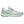 Light blue running shoe on a white background and a low profile stance.