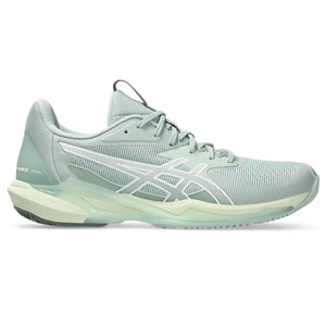 Light blue running shoe on a white background and a low profile stance.