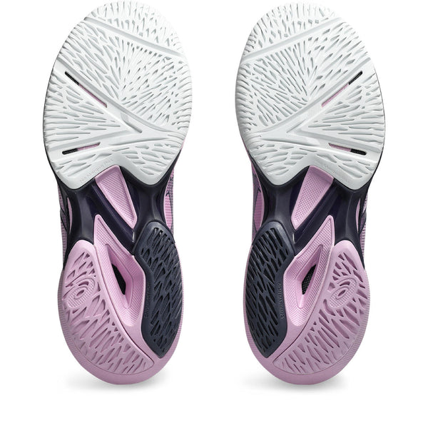 Close-up of a pink and black athletic shoe sole on a white background