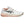 White and pink athletic shoe with black logo on a white background