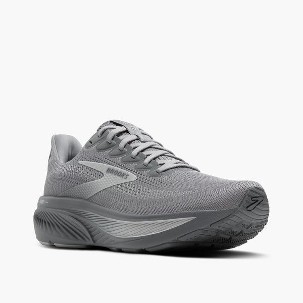 A Brooks running shoe in grey sitting at a diagonal view.
