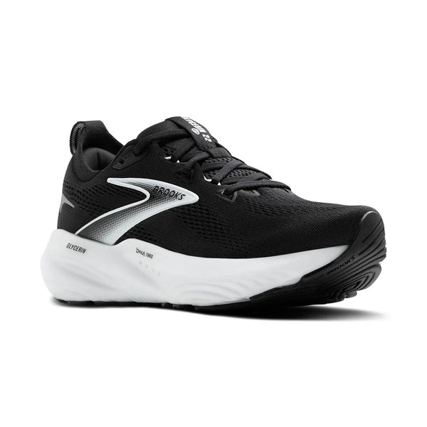 A black and white running shoe at a diagonal angle with white midsole on a white background