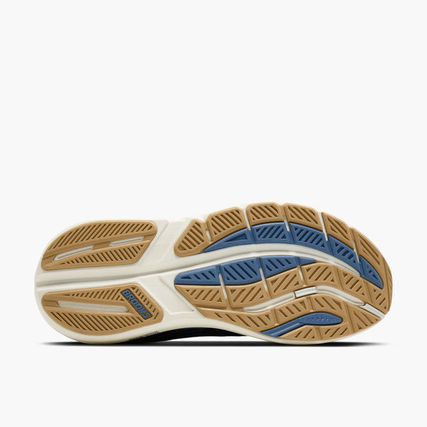 Close-up of a running shoe sole with brown and blue pattern on a white background