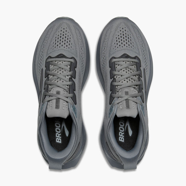 Pair of gray running shoes with 'Brooks' branding on a white background