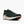 A dark green running shoe with a white midsole and orange outsole accents, shown from a side profile on a light gray background.
