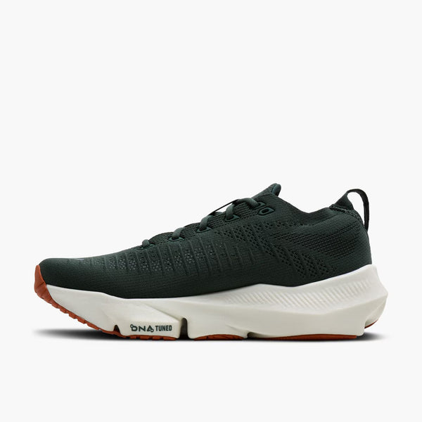 A dark forest green athletic sneaker with a thick white midsole and a small brown outsole, shown in a side profile on a light gray background.