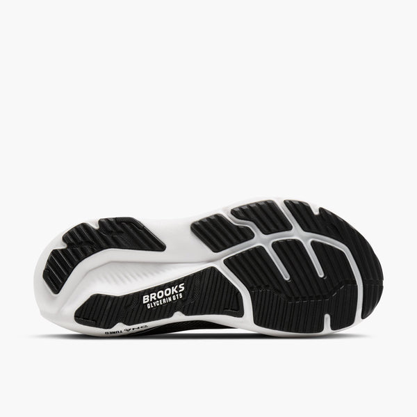 Black and white running shoe sole with 'Brooks' branding on a white background