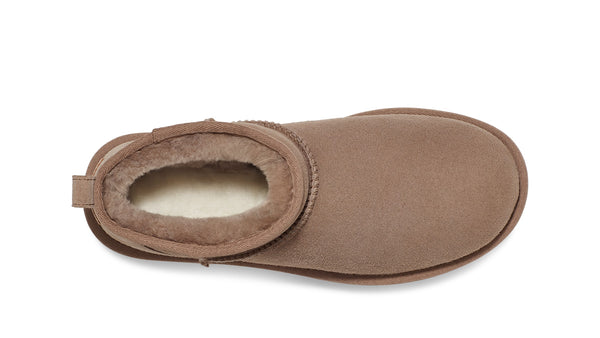 Light brown ankle boot on a white background