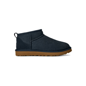 Navy ugg slipper with a tan midsole
